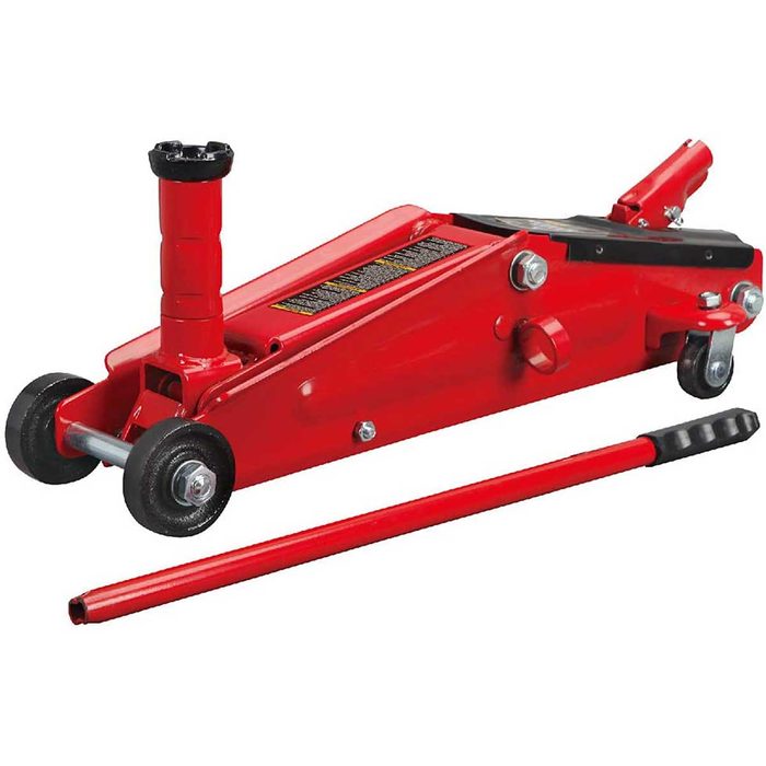 A red hydraulic jack is positioned on a flat surface, with a handle lying beside it, designed for lifting heavy objects like vehicles.