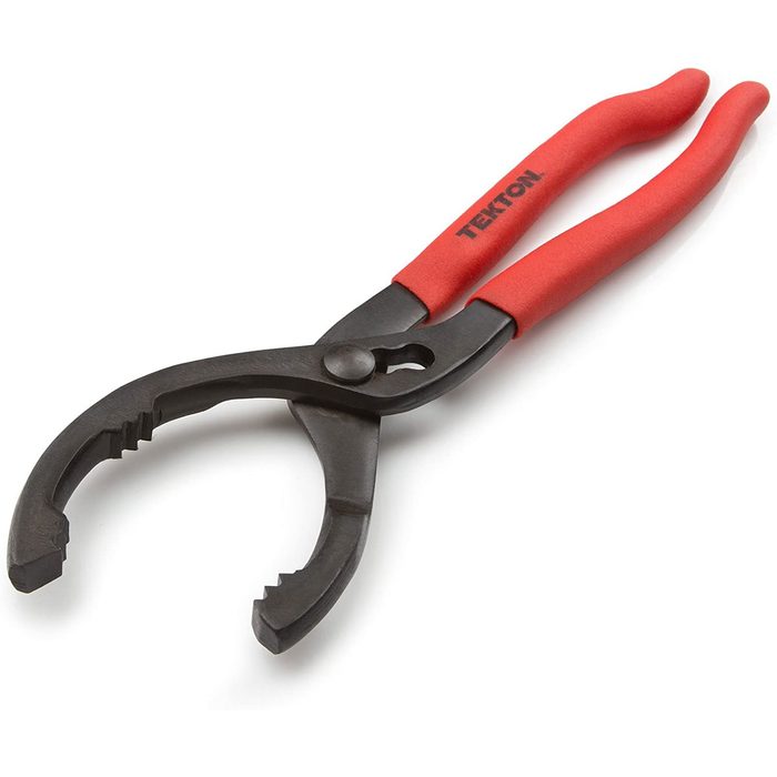 A pair of pliers with textured jaws is designed for gripping objects. The tool features red rubberized handles for comfort, set against a white background.