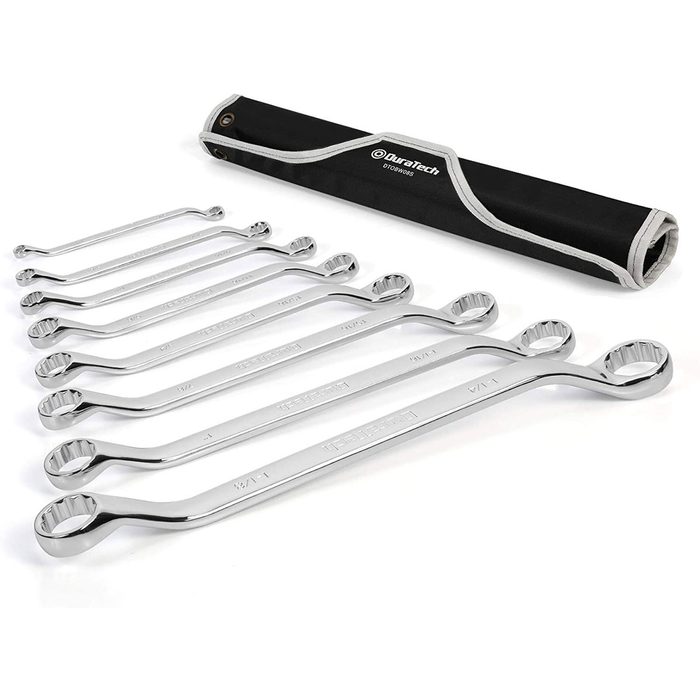 A set of chrome-plated wrenches lies neatly arranged beside a black storage pouch, showcasing various sizes for mechanical tasks in a workshop setting.