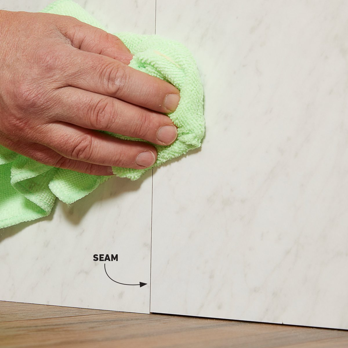 Wiping off excess seam sealer with denatured alcohol
