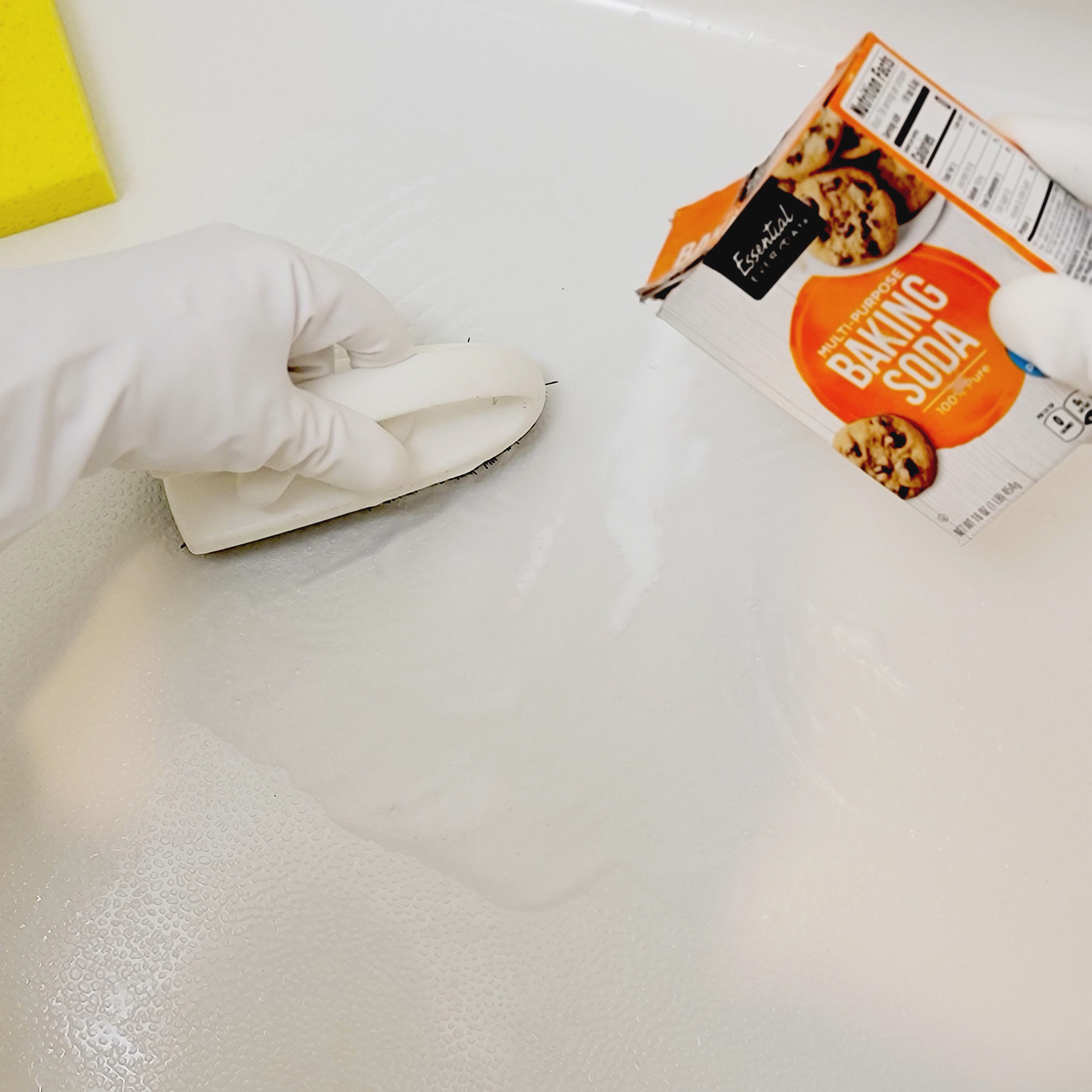 using baking soda paste to clean shower