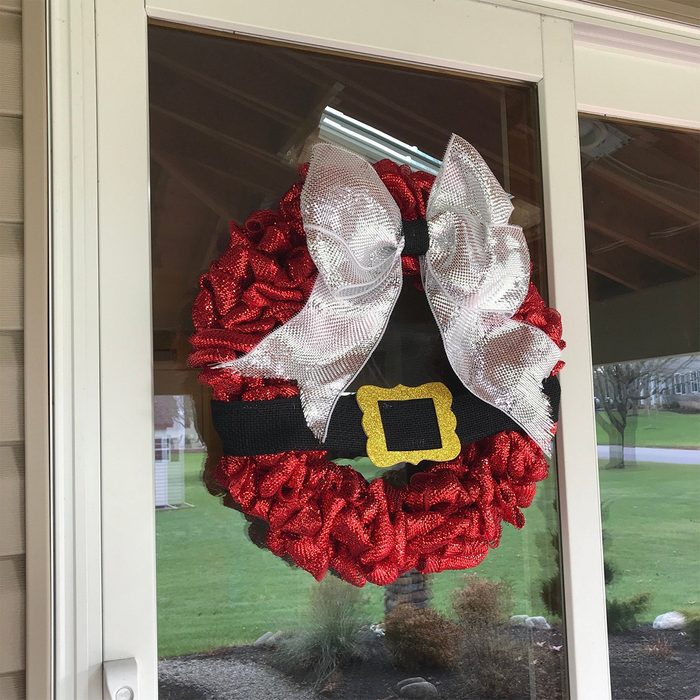 A decorative wreath resembling Santa