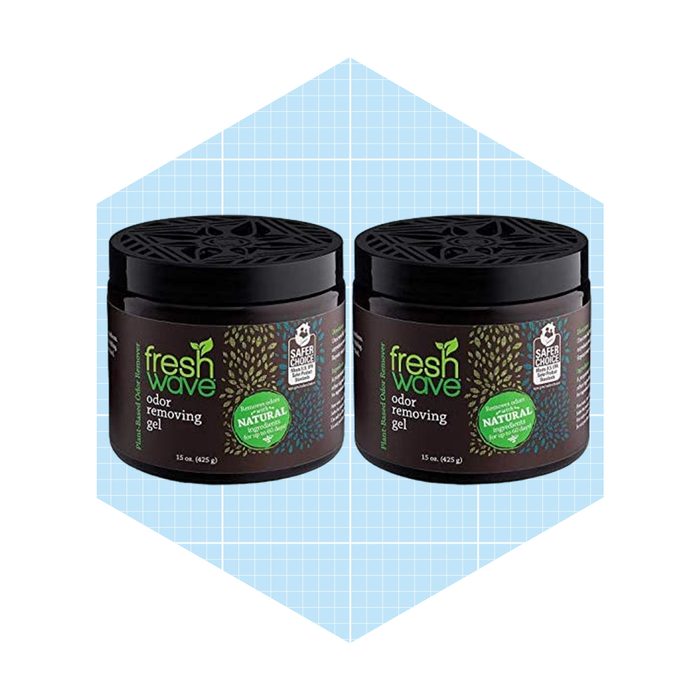 Two jars of Fresh Wave odor removing gel are positioned side by side on a light blue grid background, showcasing their natural odor-elimination properties.