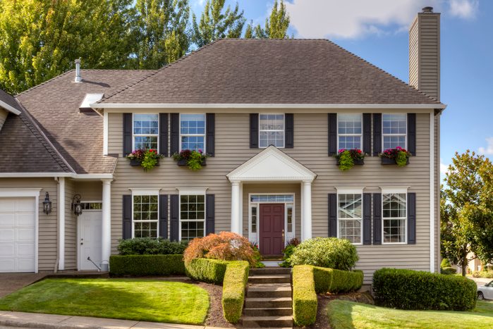Traditional style home with window shutters