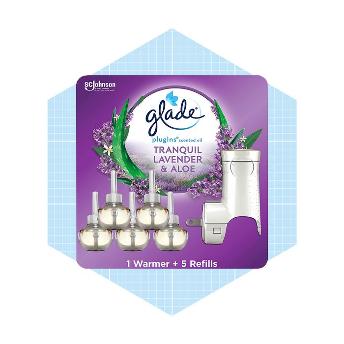 A pack of Glade plug-in scented oil, featuring one warmer and five refill bottles labeled 