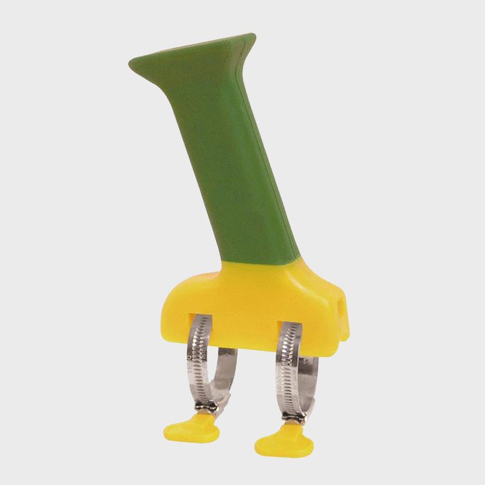 A colorful kitchen tool, shaped like a duck, is designed to hold food items securely while cooking or serving, demonstrating a playful yet functional design.