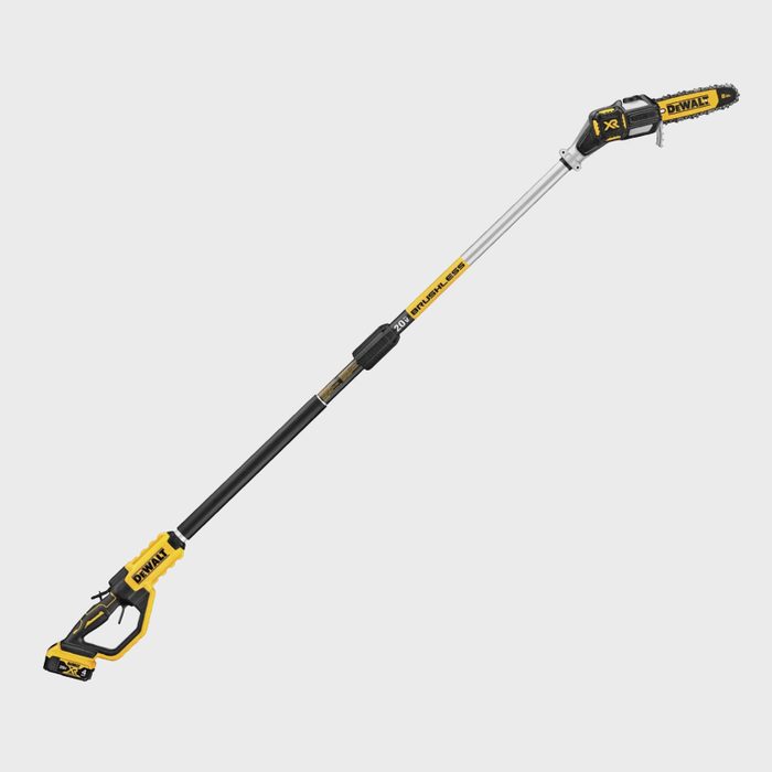 A cordless pole saw with a yellow and black design is extended for cutting branches, ideal for trimming trees at height in outdoor settings.