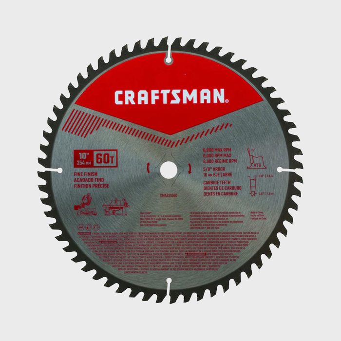 A circular saw blade rests flat, featuring sharp teeth along the edge. It is labeled 