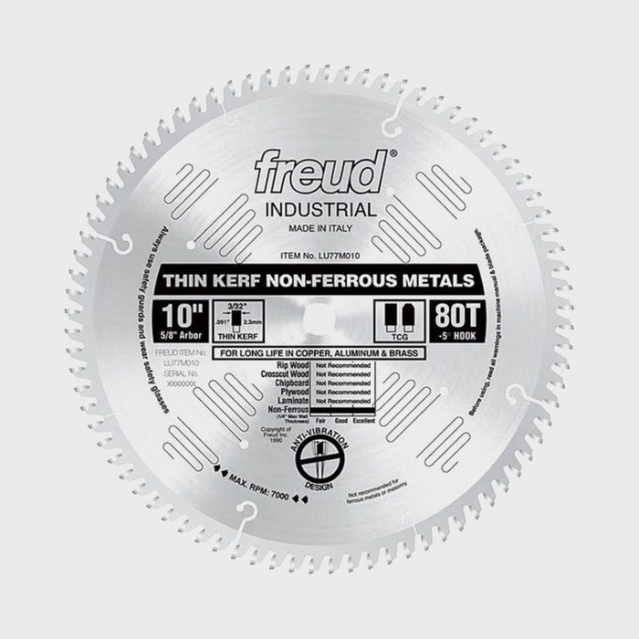 A circular saw blade rests on a neutral background, labeled for cutting non-ferrous metals, featuring sharp teeth and detailed specifications around its center.