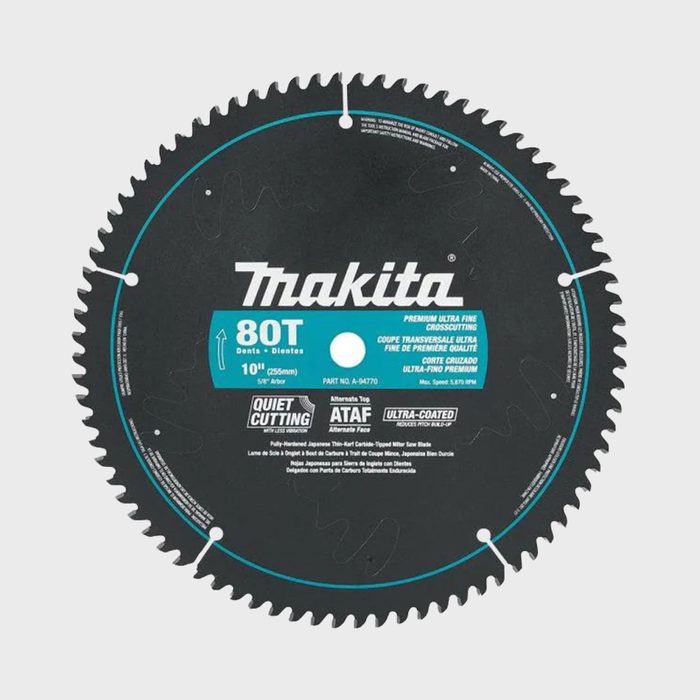 A circular saw blade displays sharp teeth, labeled with specifications and branding. Designed for precise cutting, it features a black surface with a blue center.