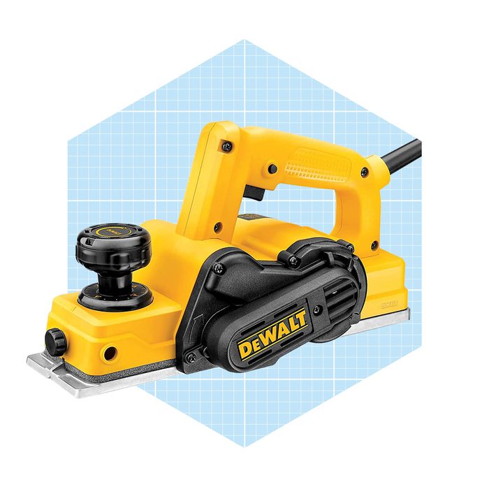 A yellow electric planer is positioned forward, with a power cord attached, set against a light blue grid background, showcasing its design and features.