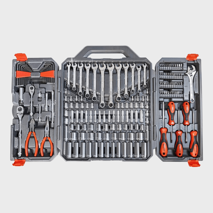 A comprehensive tool set is open, showcasing various wrenches, sockets, and pliers, organized neatly in a gray case with orange accents.