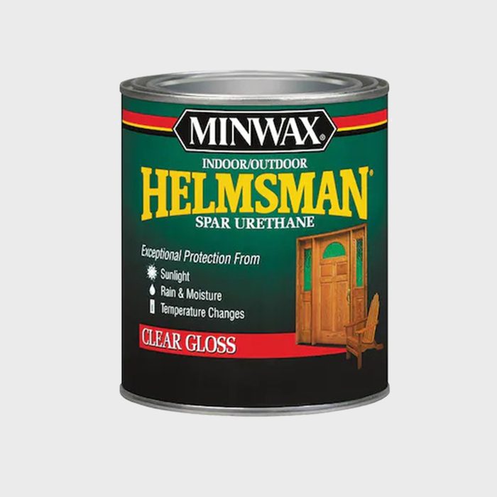 A metal can of Minwax Helmsman spar urethane sits upright, displaying its green label, promising exceptional protection from sunlight, moisture, and temperature changes. Clear gloss finish.