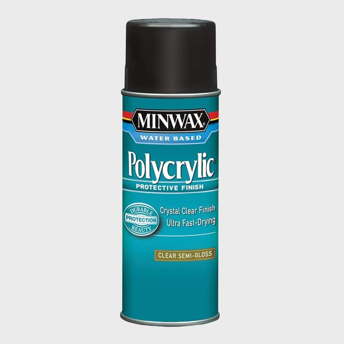 A cylindrical spray can labeled 