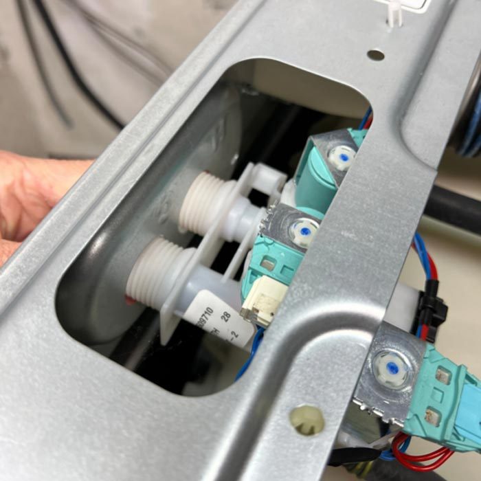 Push Fill Valve Into The Holes Of The Washer Body