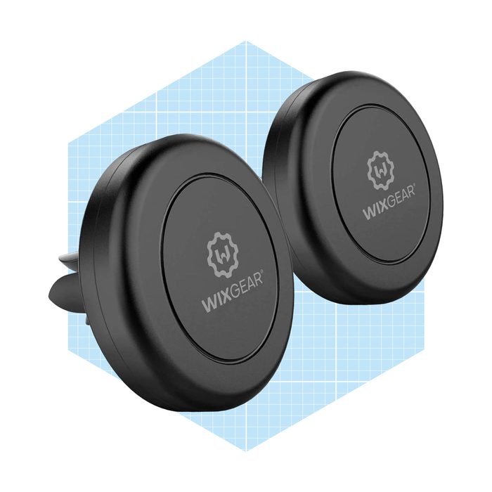 Two circular black car phone mounts are positioned side by side, featuring the 