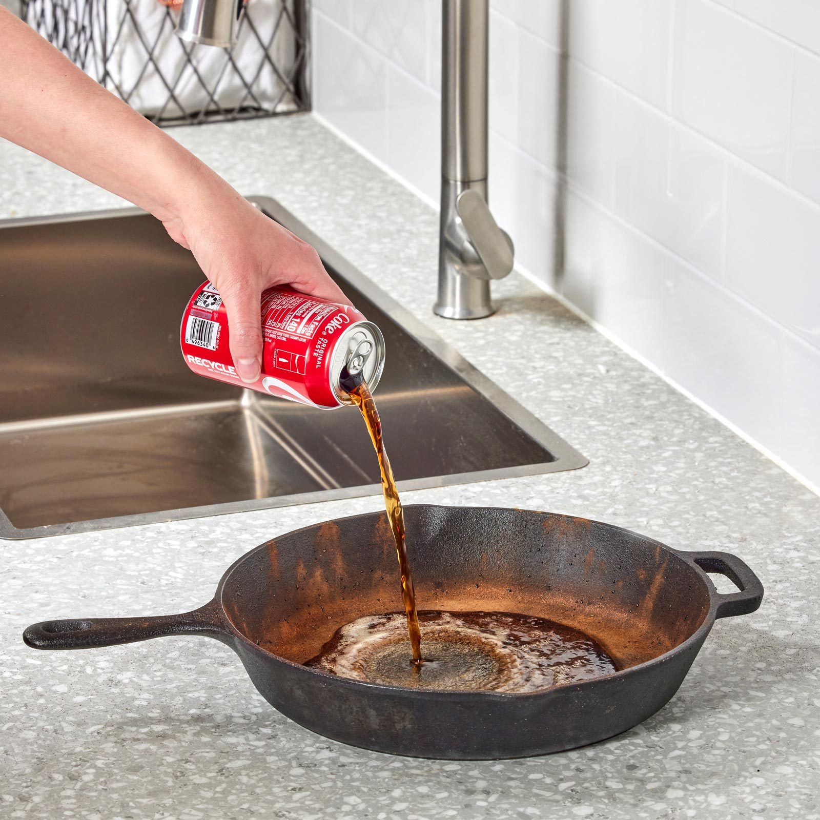 cleaning a cast iron pan with coca cola