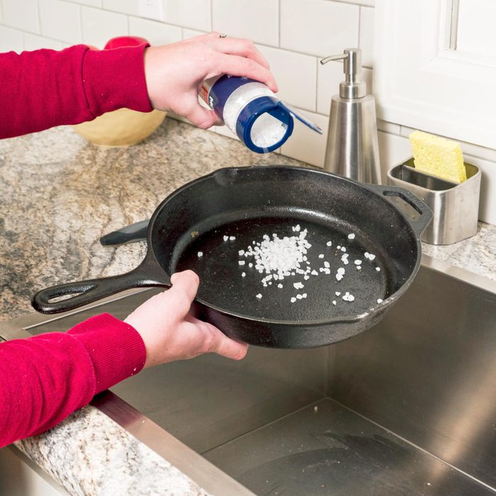 cleaning a cast iron pan with salt