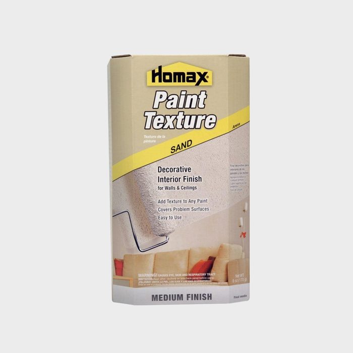 A box of Homax Paint Texture in sand finish sits upright, promoting a decorative interior finish for walls and ceilings, with usage instructions visible.