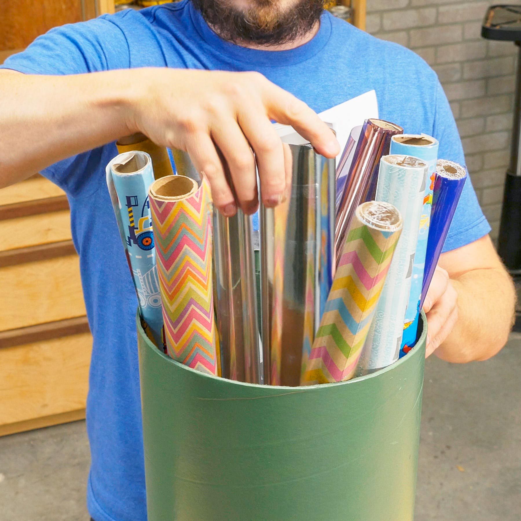 holding wrapping paper in a recycled concrete tube