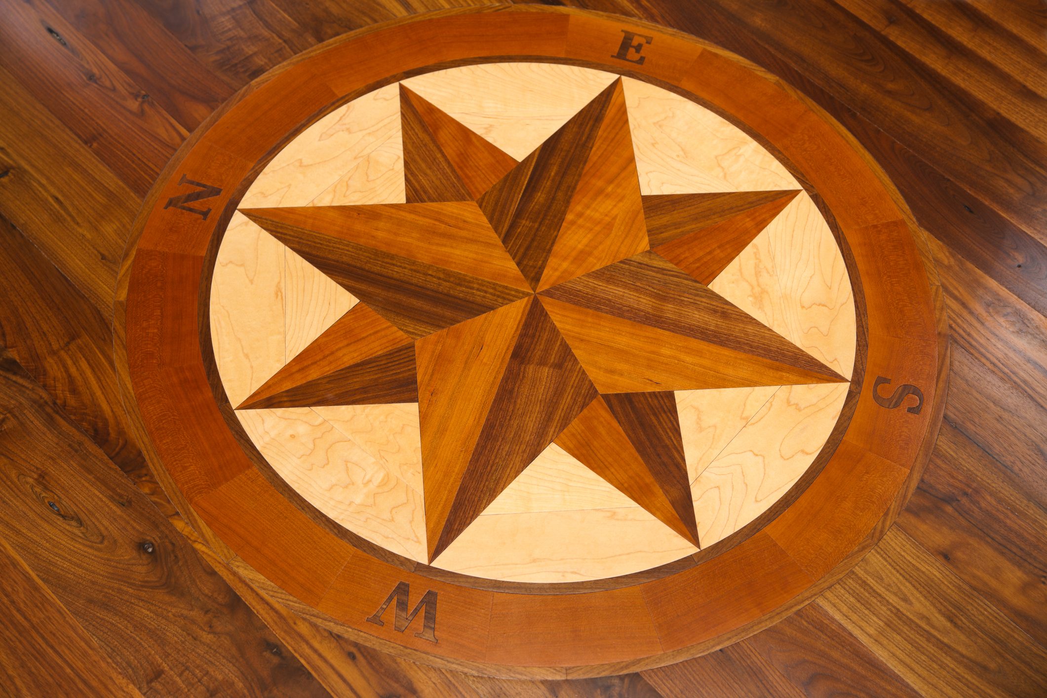 Compass inlay in a hardwood floor.
