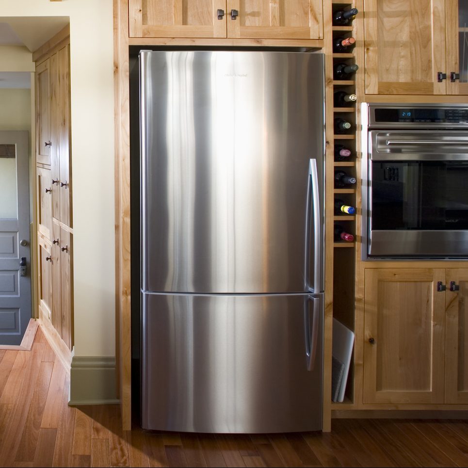 Back Door in Kitchen With Built-In Wood Cabinets