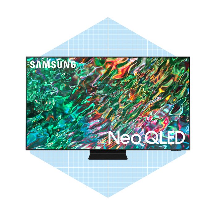 A Samsung Neo QLED TV displays vibrant, swirling colors resembling water on its screen, positioned against a light blue geometric background.