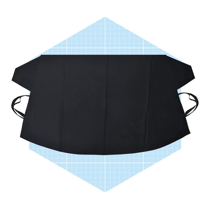 A black apron lies flat, featuring ties on the sides, set against a light blue, grid-patterned background.