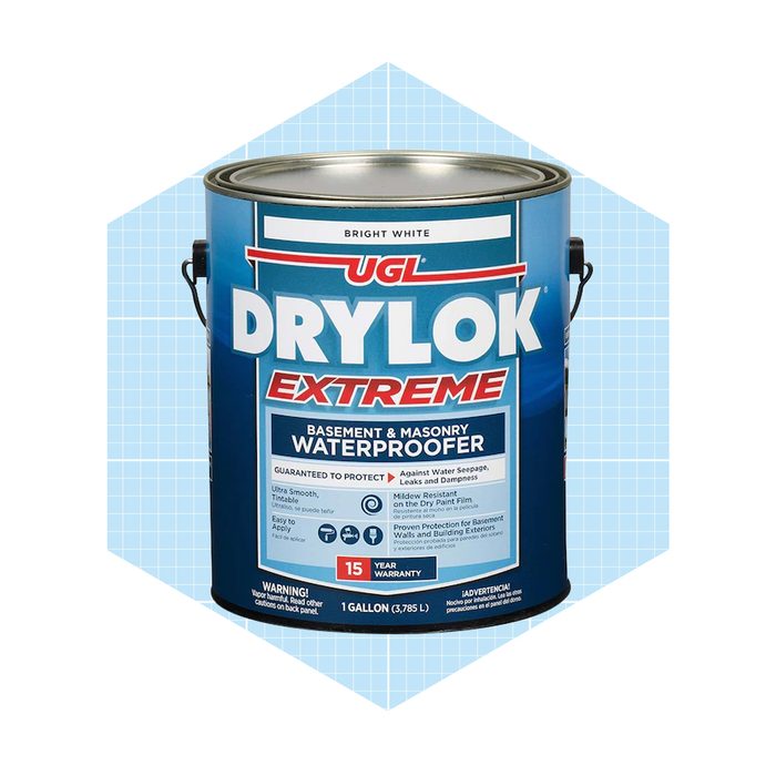A blue paint can labeled "U.D.L. DRYLOK EXTREME" stands upright, indicating it
