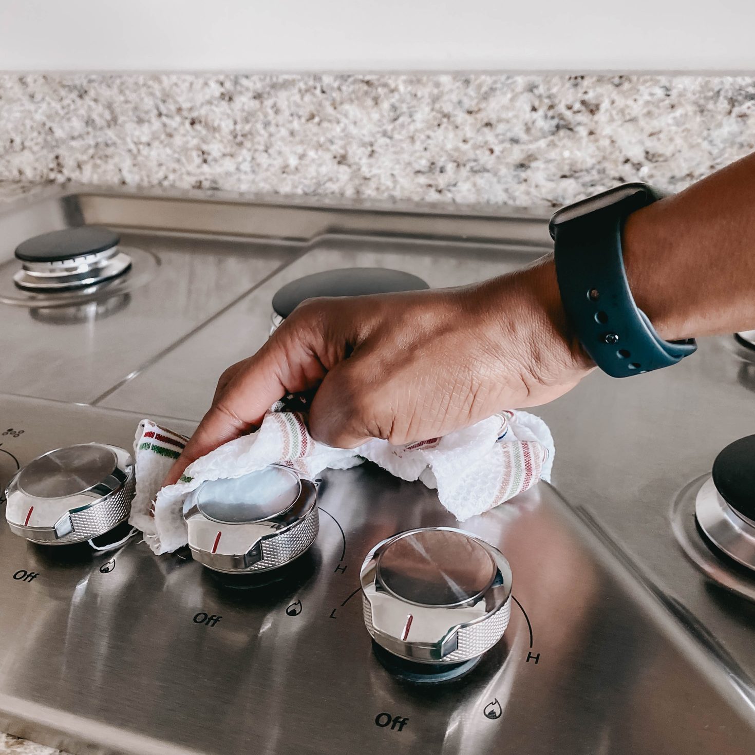 Woman Wipes Cooktop