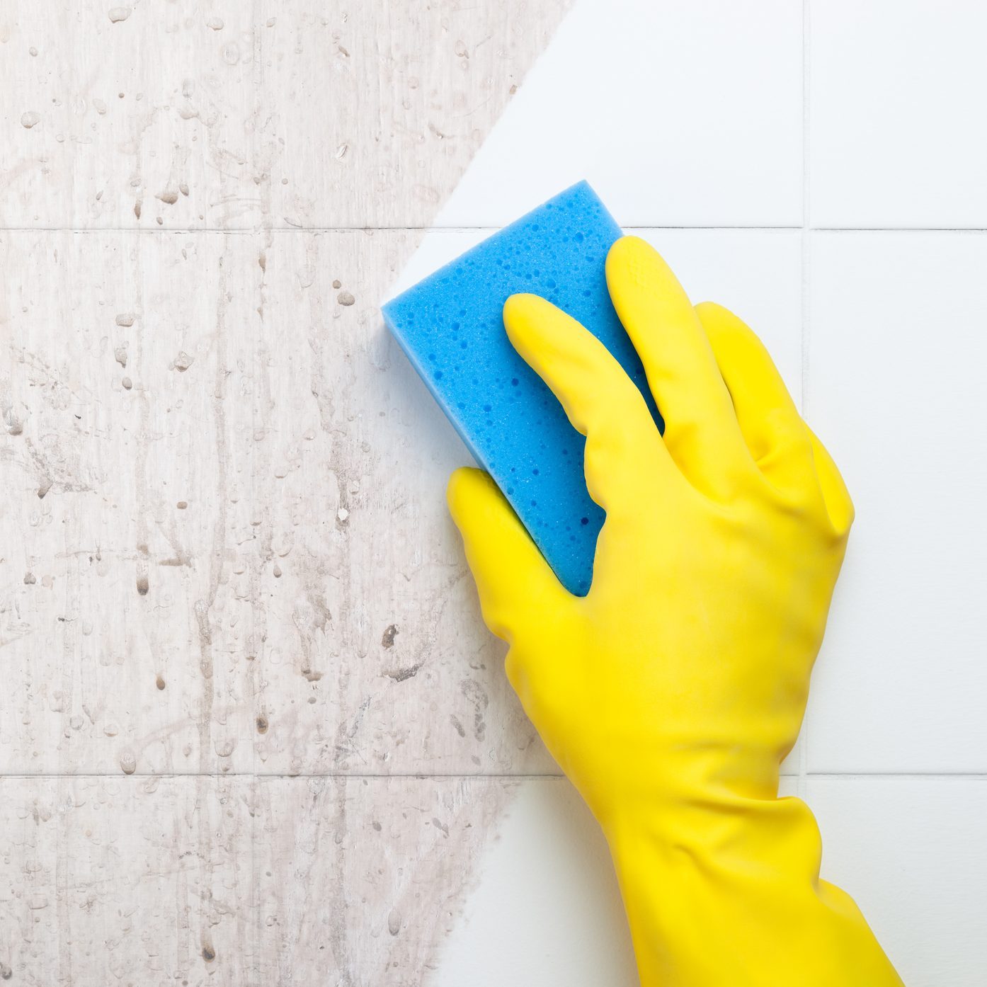 Cleaning shower wall tiles with dawn power wash and a sponge