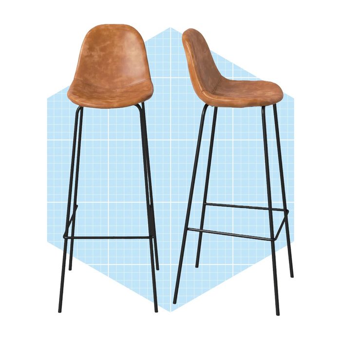 Two modern bar stools, with brown leather seats and black metal legs, are displayed against a light blue geometric background.