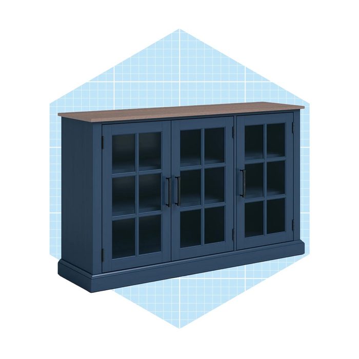 A navy blue cabinet with glass doors showcases shelves inside, standing on a flat surface against a blue grid background.