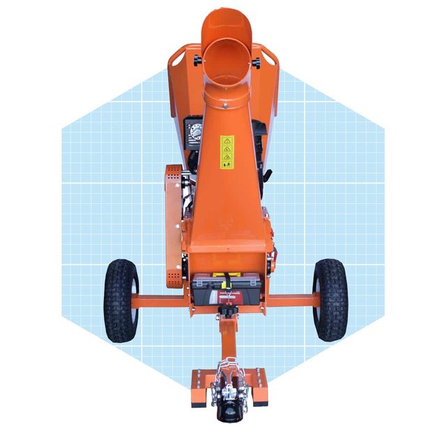 An orange wood chipper displays an intake chute atop, with wheels for mobility, positioned against a light blue grid background.
