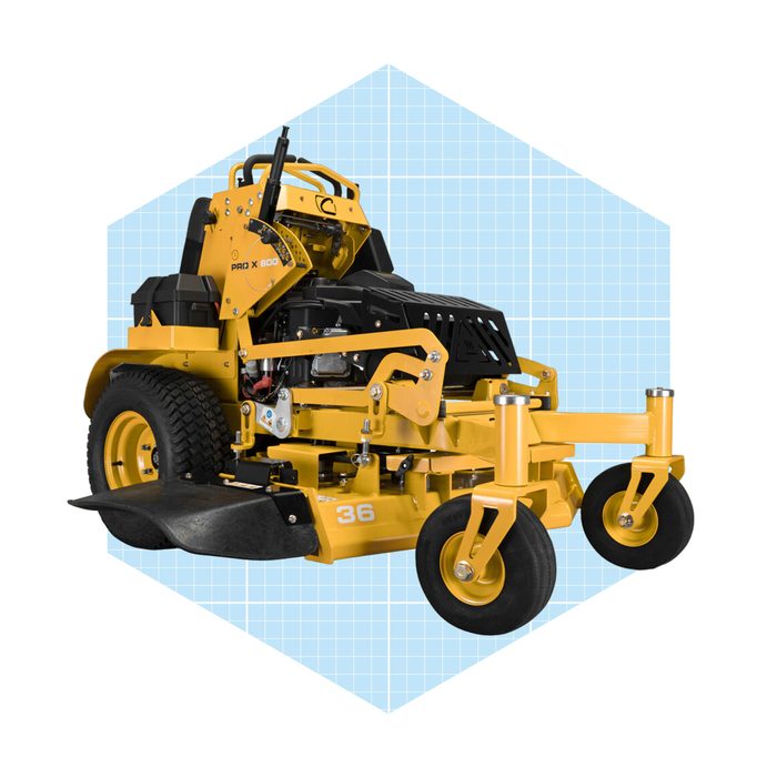 A yellow lawn mower sits on a light blue grid background, featuring large rear wheels, a cutting blade, and a seat for operation.