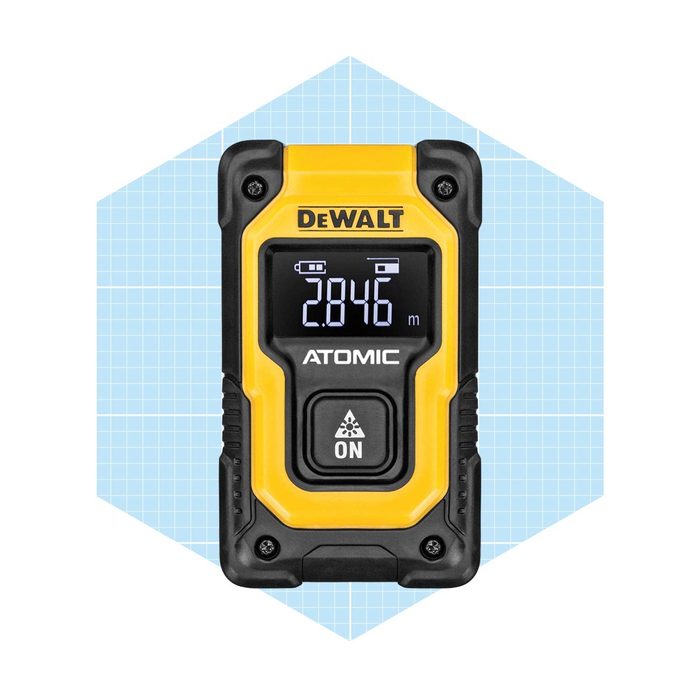 A yellow and black laser distance meter displays a measurement of 2846 meters, with buttons for operation, set against a light blue grid background.