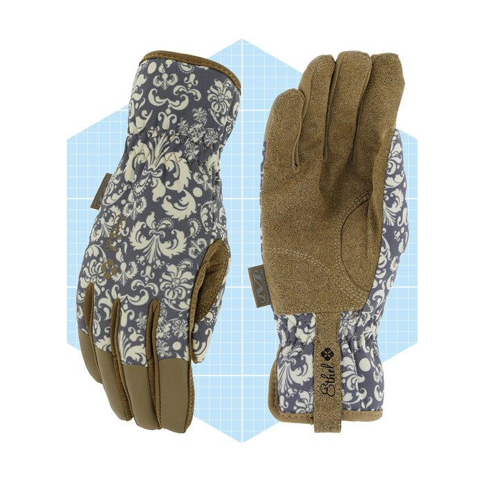 A pair of patterned gloves rests against a light blue grid background, showcasing a floral design and tactile palm for grip and functionality.