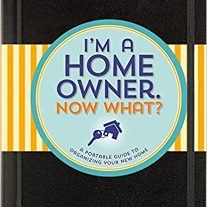 A black notebook features a circular cover with the text “I