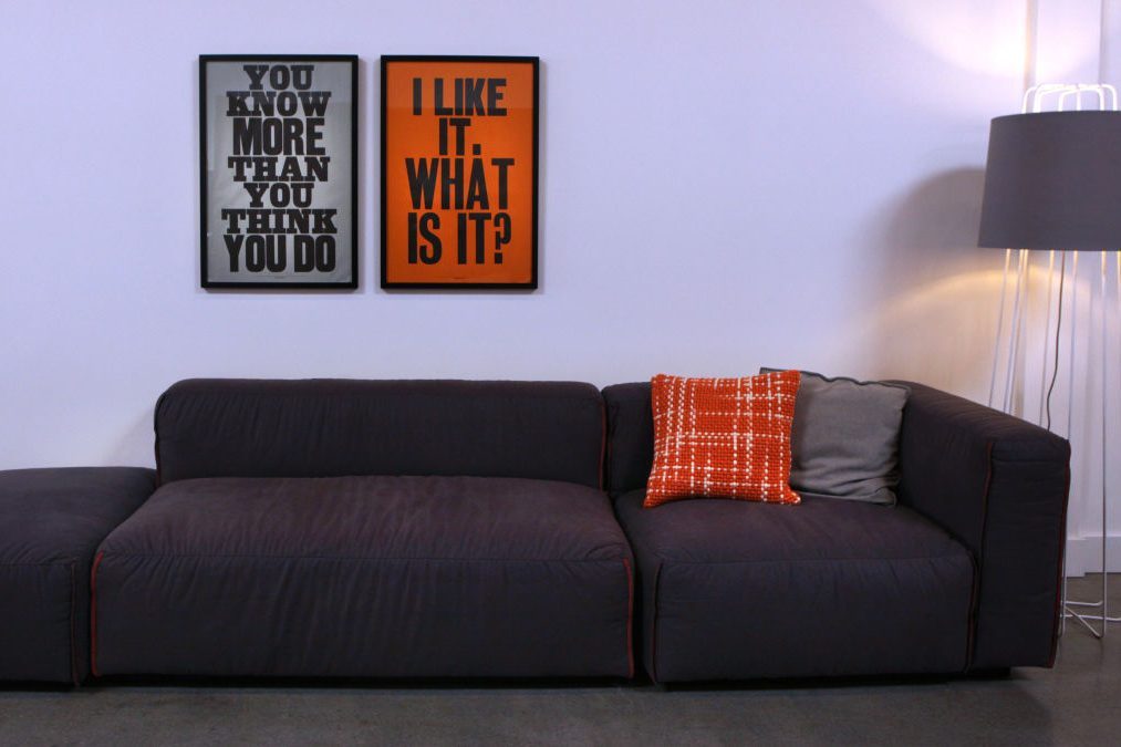 Prints by British graphic artist Anthony Burrill hang over 