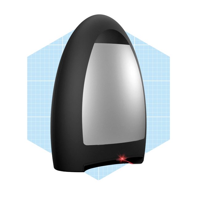 A sleek, black device with a reflective surface emits a red laser beam, set against a light blue, grid-patterned background.