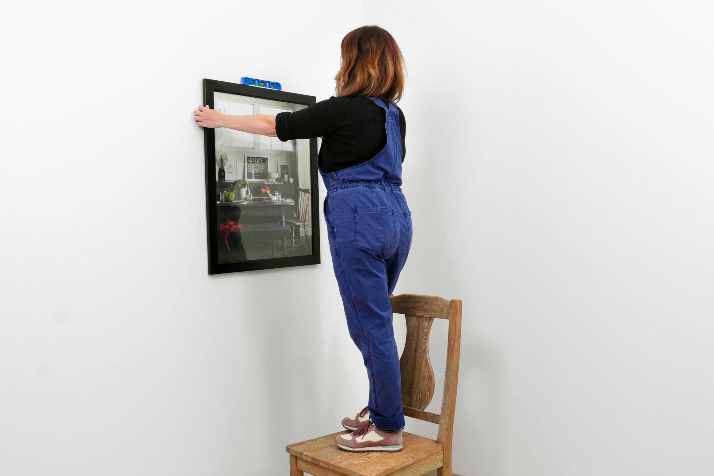 hanging the picture on the wall