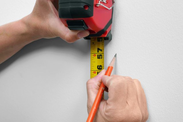 measuring and marking the wall