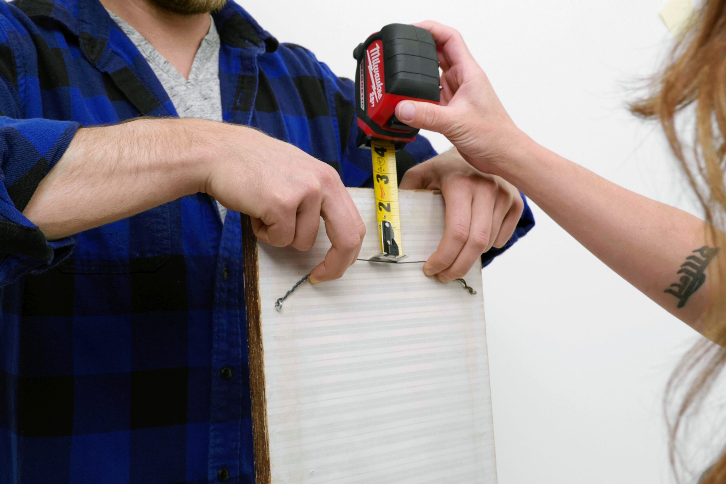 tape measure lifting up the wire o note back of a frame