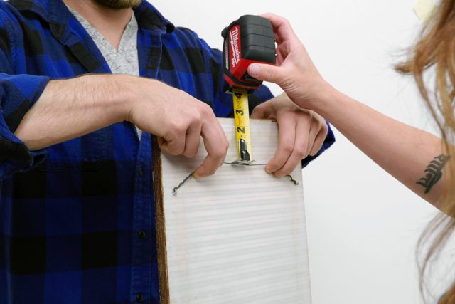 tape measure lifting up the wire o note back of a frame