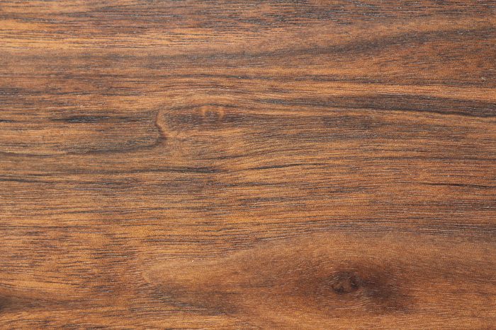 Wood background or dark brown texture. Texture of old wood use as natural background. Top view of brown black american walnut wood paneling. Copy space