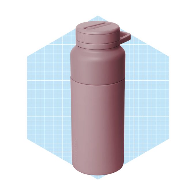 A pink water bottle stands upright on a blue grid background, showcasing its sleek design and a secure, fitted lid for convenient drinking.