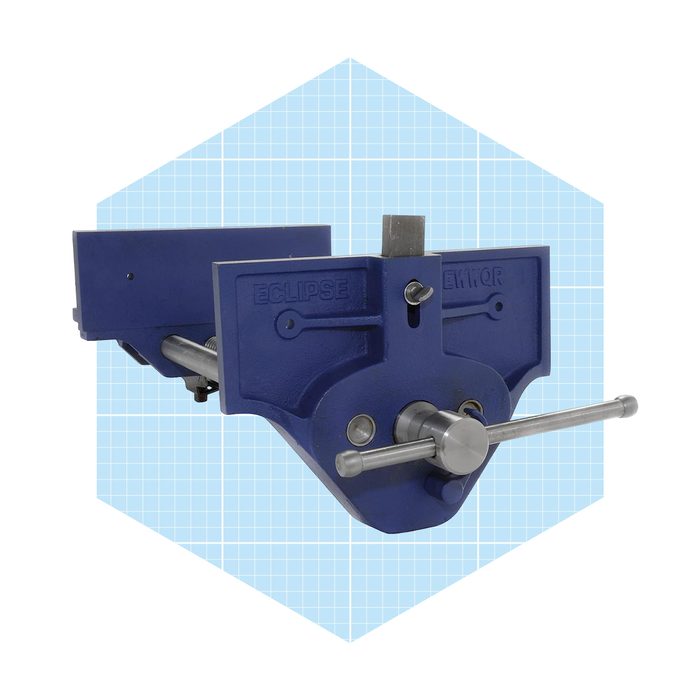 A blue vice is positioned centrally, tightening materials using a metal screw mechanism, set against a light blue grid background.