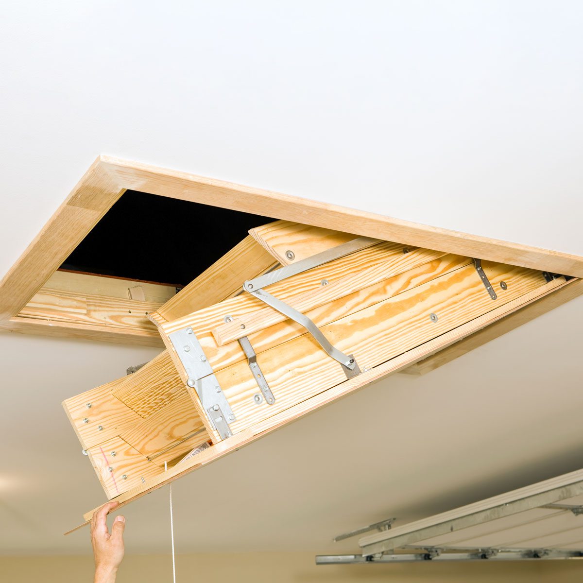 Folding Attic Access Ladder in a Garage