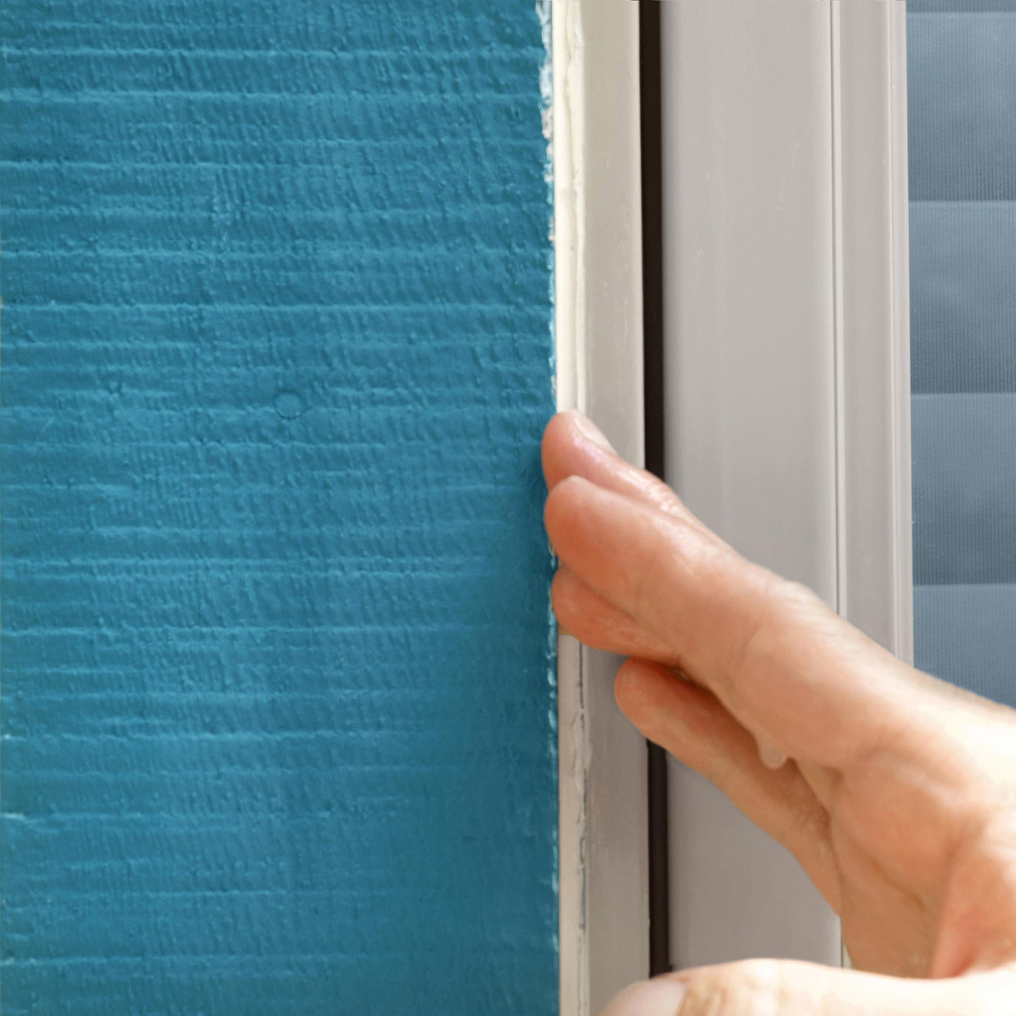 Checking the caulk with water dipped finger