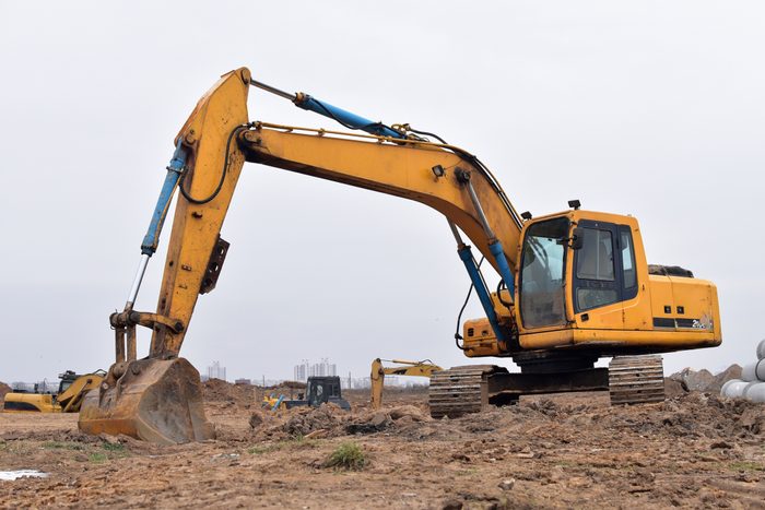 Excavator with a large iron bucket